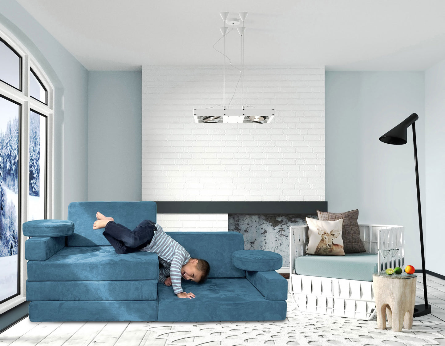 Young boy laughing and playing on a Mod Blox 10-piece modular foam couch in a modern living room.