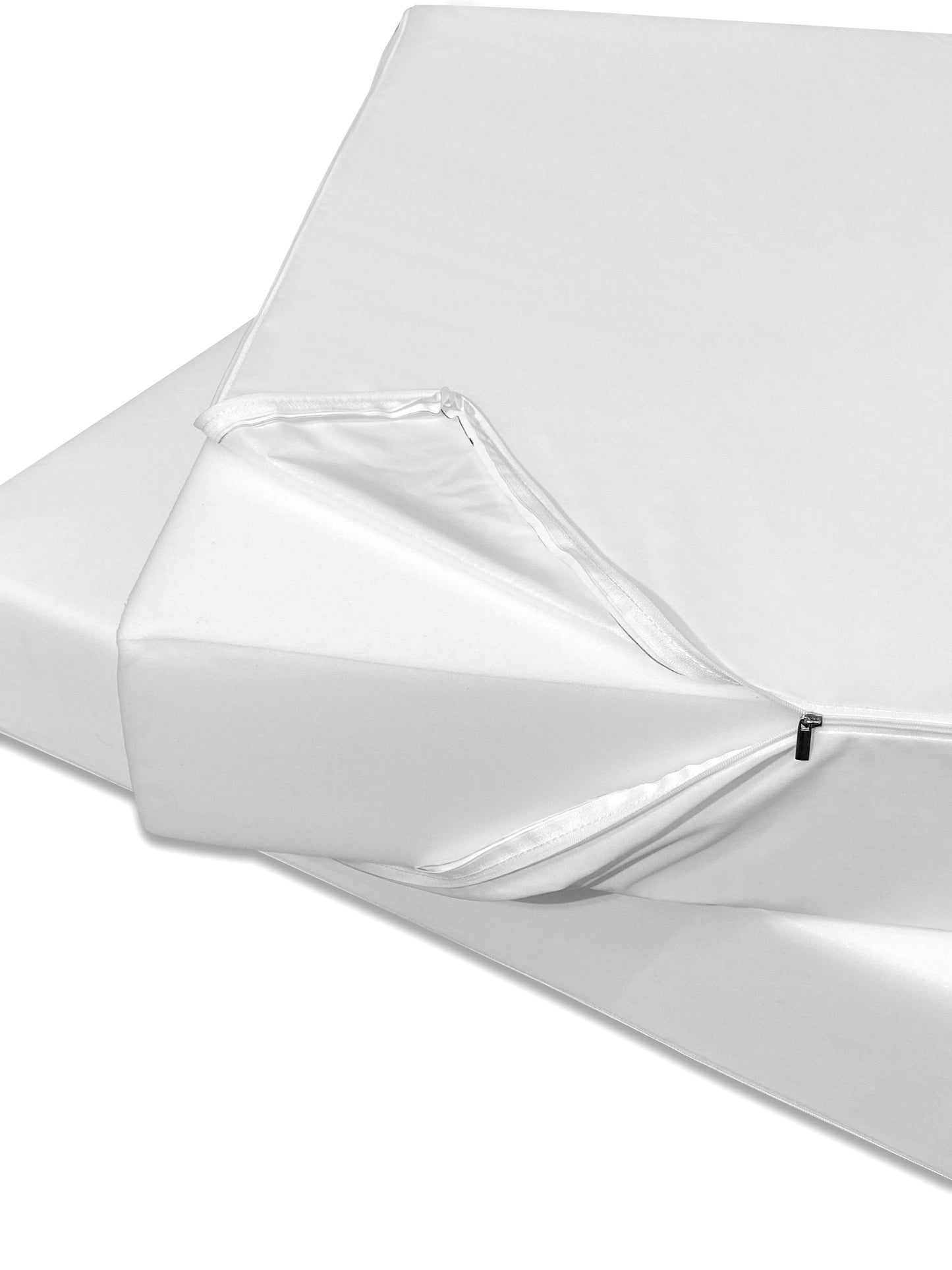 Close-up of a white waterproof couch cushion liner covering a foam modular furniture piece with a visible zipper detail.