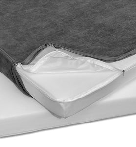 Sofa cushion liner revealed beneath a grey couch cover, showcasing the under couch liner material.